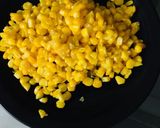 A picture of step 1 of Corn masala chaat.