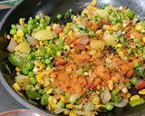 A picture of step 2 of Red Poha Masala With Veggies, Sprouts and Nuts.