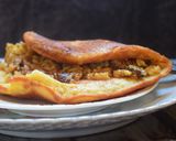 A picture of step 11 of Murtabak - stuffed pan-fried bread.