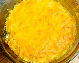 A picture of step 4 of Hake in the oven under a cheese crust.