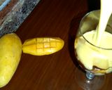A picture of step 3 of Mango milk shake with chocolate and nuts.