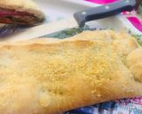 Foto del paso 11 de la receta: Empanada arrollada de pastrón y quesos 🥓🫑🧀🧅