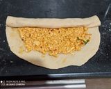 A picture of step 3 of Peri peri paneer pinwheel Paratha.