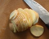 A picture of step 2 of Hasselback potatoes.
