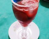 A picture of step 7 of Watermelon Mojito with blue Curacao.