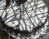 A picture of step 8 of Eggless Whole wheat Vanilla cake with white chocolate ganache.