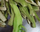A picture of step 1 of Peels of raw banana with potato curry.
