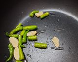 A picture of step 2 of Green chilli Thecha.