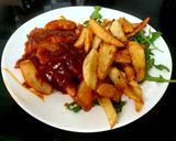 A picture of step 8 of My Tasty Chicken, Onion in BBQ Sauce with Homemade Chips 🤩.