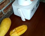A picture of step 1 of Mango milk shake with chocolate and nuts.