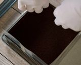 A picture of step 15 of Tiramisu, and Cocoa Sponge with plenty of Coffee Syrup.