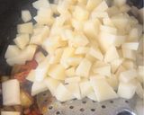 A picture of step 4 of Potato Onion Tomato Sabzi.