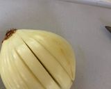 A picture of step 5 of Anti Vampire Cheese Sauce, with Onions and Garlic.