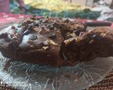 A picture of step 10 of Eggless Date and Walnut Cake.