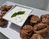 A picture of step 7 of Spicy lamb meatballs with a tangy yoghurt sauce.