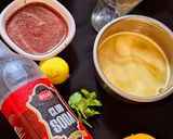 A picture of step 3 of Mulberry Orange Sunset layered Mocktail.