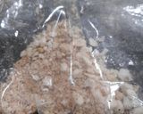 A picture of step 7 of Gajar ka halwa with peels.