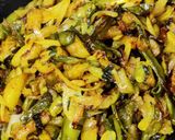 A picture of step 6 of Runner beans and potato fry with onion and onion greens.