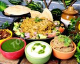 A picture of step 5 of Uttar Pradesh Urad Daal Aur Naye Chawal ki Khichdi Aloo Bharte Aur Hari Chutney (dinner or lunch).