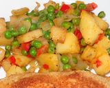 A picture of step 3 of Chicken Breast Stuffed with Ham and Cheese. Peas and Potatoes.