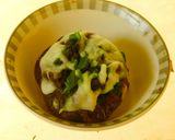 A picture of step 4 of Hummus stuffed cheesy mushrooms.