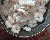A picture of step 1 of Prawns with coconut and kokum masala curry.