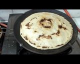 A picture of step 2 of White sorghum chapati on clay tawa.