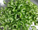 A picture of step 1 of Kaju Karela.