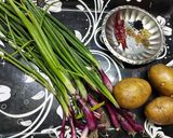 A picture of step 1 of Potatoes with Green Onion.