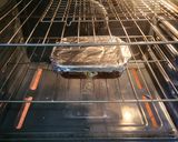 A picture of step 9 of Bourbon barbecue chicken lasagna roll ups.