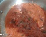 A picture of step 5 of Shakshuka with warm garlic bread (poached eggs in spicy sauces).