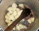 A picture of step 3 of Goat pilau with potatoes and coconut.