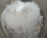 A picture of step 1 of Eggless mawa cup cake topping with shrikhand.