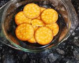 A picture of step 3 of Easy Biscuits orange Trifle.