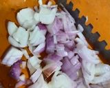 A picture of step 1 of Sev tamatar nu saag.