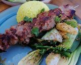 A picture of step 6 of Asian style pork kebabs, steamed veg and yellow rice.