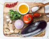 A picture of step 1 of Baingan Bharta (Smoky Eggplant Curry).