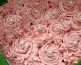 A picture of step 6 of Chocolate cake with strawberry rosette frosting.