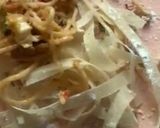 A picture of step 2 of Left over chowmien wrapped with torn Manda patti strips.