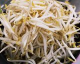 A picture of step 1 of Sambal bean sprouts with fish cake and fried tofu puff.
