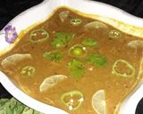 A picture of step 12 of Chicken daal.