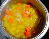 A picture of step 2 of Pumpkin and Carrot Soup.