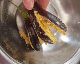 A picture of step 1 of Stuffed Brinjal potatoes in gravy.