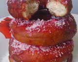 A picture of step 10 of Red Glazed Eggless Doughnuts with Coconut.