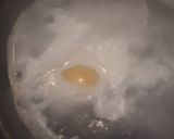 A picture of step 5 of Poached Egg served with baked beans.