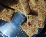 A picture of step 11 of Fruity Coconut Crumble Squares.