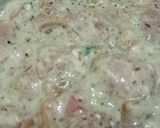 A picture of step 3 of Malai boti pizza with white sauce.