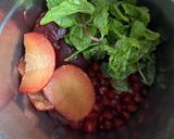 A picture of step 1 of Pomegranate Plum & Mint Juice.