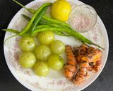 A picture of step 1 of Instant Amla, Fresh Haldi & Green Chili Pickle.