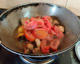 A picture of step 6 of Onion Tomato Chicken.